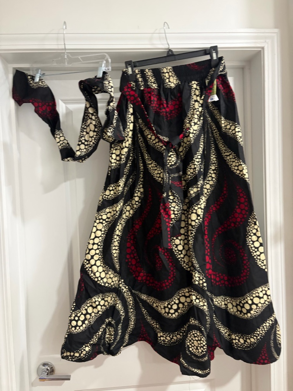 Asymmetrical Black Midi Skirt with Cream & Red Swirl Pattern